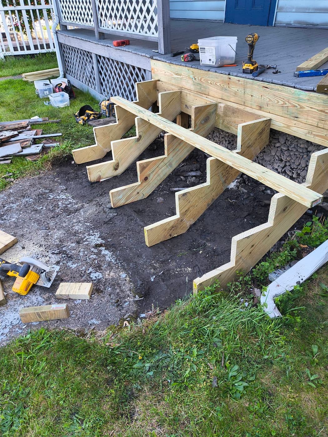 Deck stair stringers being framed on a job in Endicott
